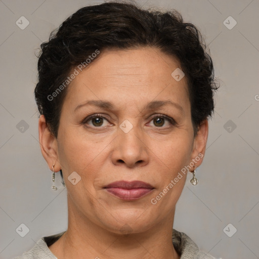 Joyful white adult female with short  brown hair and brown eyes