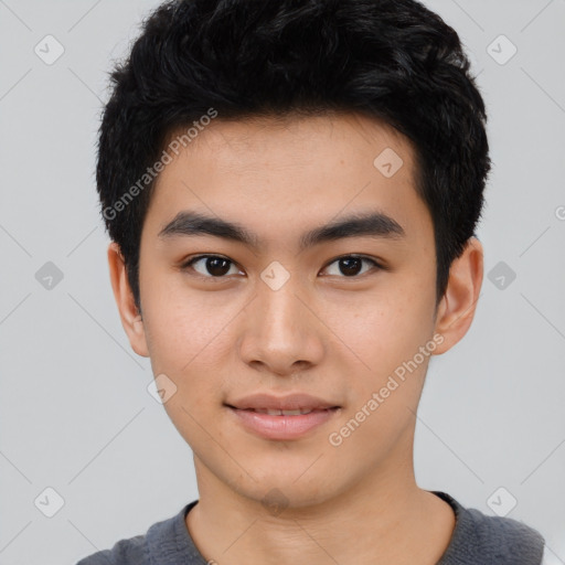 Joyful asian young-adult male with short  black hair and brown eyes