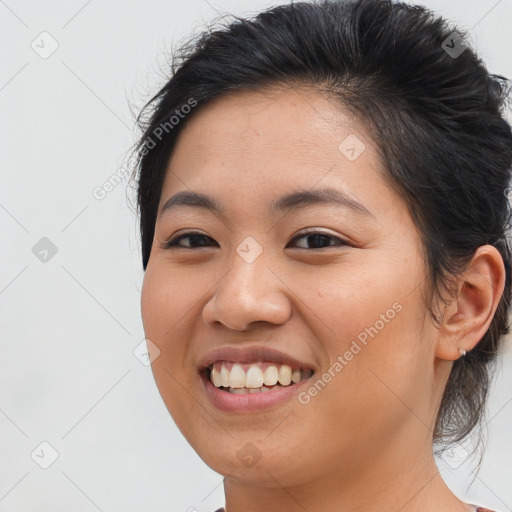 Joyful asian young-adult female with long  brown hair and brown eyes