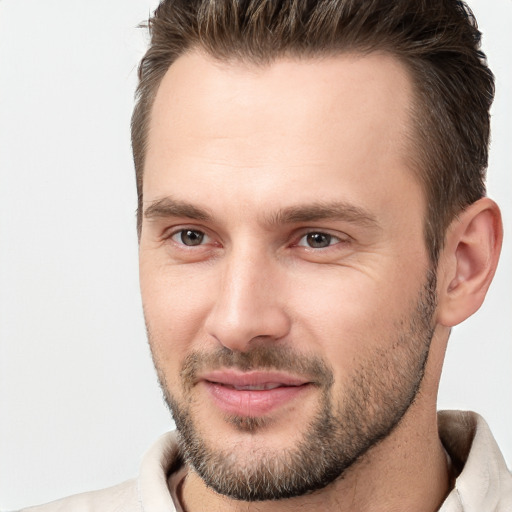 Joyful white young-adult male with short  brown hair and brown eyes