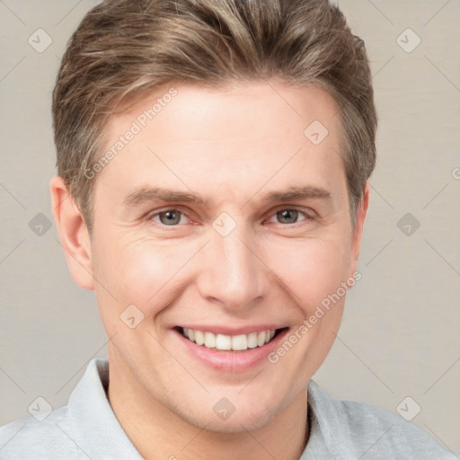 Joyful white adult male with short  brown hair and grey eyes