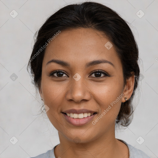 Joyful latino young-adult female with medium  brown hair and brown eyes