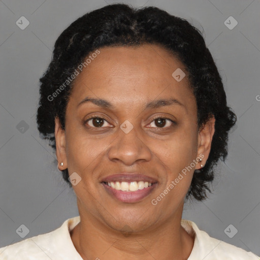 Joyful black adult female with short  brown hair and brown eyes