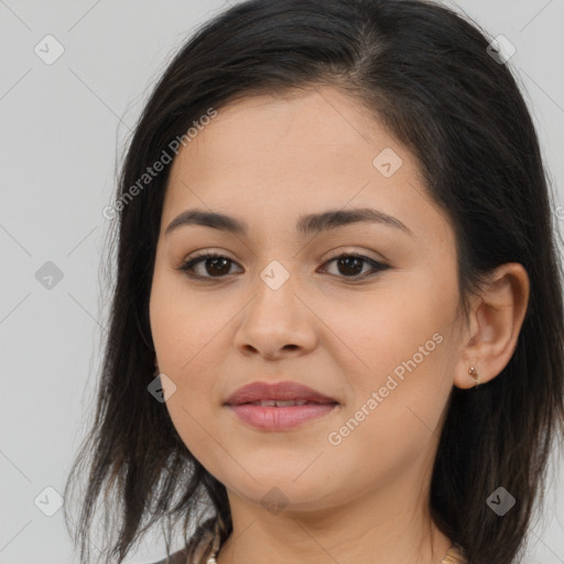 Joyful latino young-adult female with long  brown hair and brown eyes