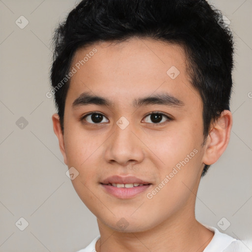 Joyful asian young-adult male with short  black hair and brown eyes