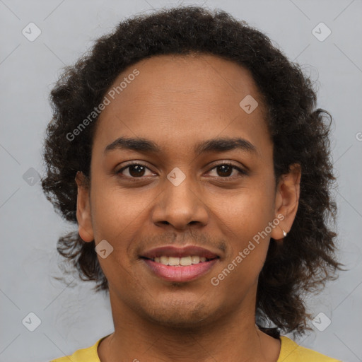 Joyful latino young-adult male with short  brown hair and brown eyes