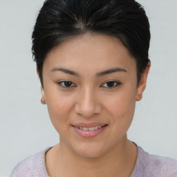 Joyful asian young-adult female with short  brown hair and brown eyes