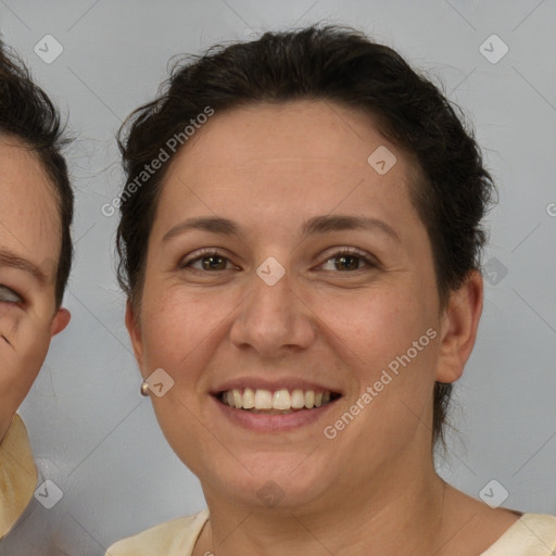 Joyful white adult female with short  brown hair and brown eyes