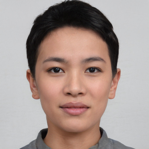 Joyful asian young-adult female with short  black hair and brown eyes