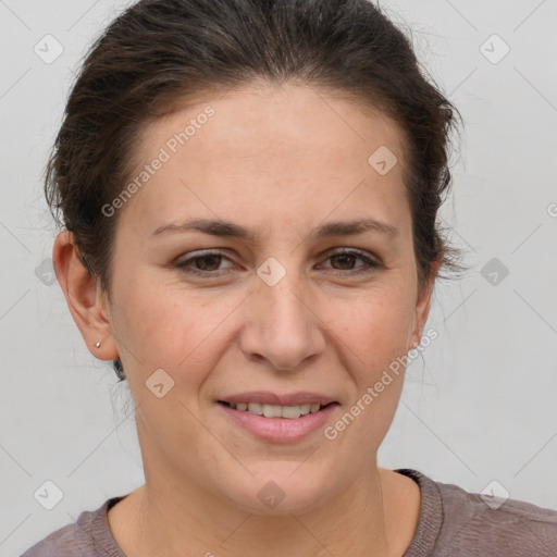 Joyful white adult female with short  brown hair and brown eyes