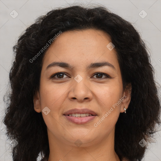 Joyful latino adult female with medium  brown hair and brown eyes