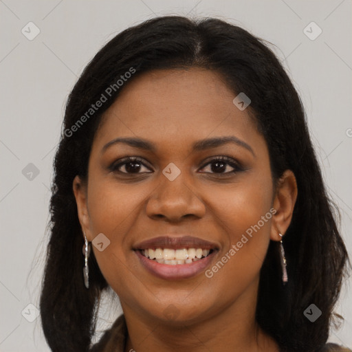 Joyful black young-adult female with long  brown hair and brown eyes