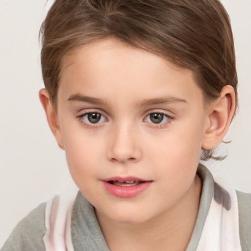 Joyful white child female with short  brown hair and brown eyes