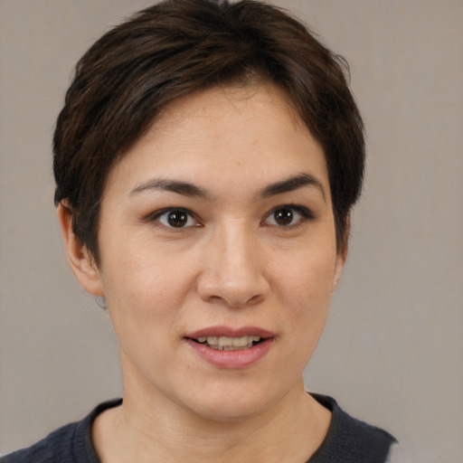 Joyful white young-adult female with short  brown hair and brown eyes