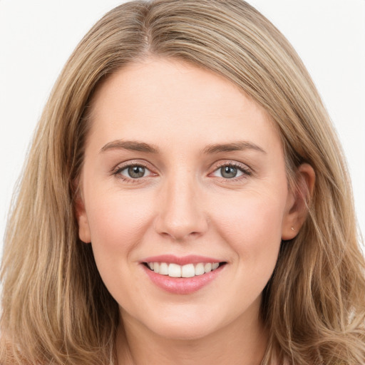 Joyful white young-adult female with long  brown hair and green eyes