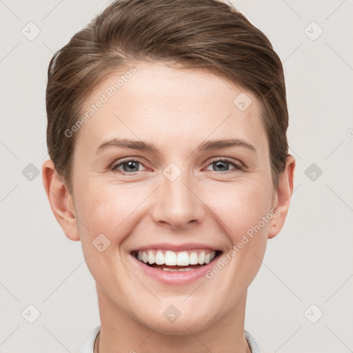 Joyful white young-adult female with short  brown hair and grey eyes