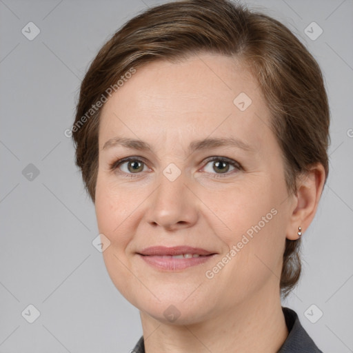 Joyful white adult female with medium  brown hair and grey eyes