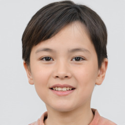 Joyful white child female with short  brown hair and brown eyes
