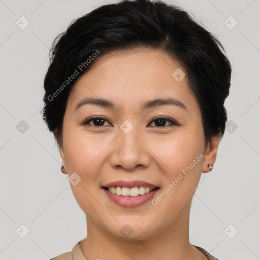 Joyful asian young-adult female with short  brown hair and brown eyes