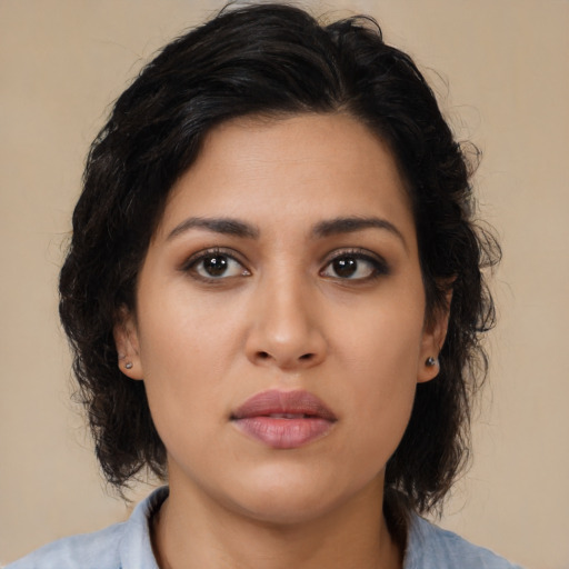 Neutral latino young-adult female with medium  brown hair and brown eyes
