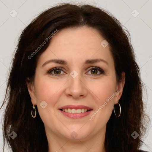 Joyful white adult female with long  brown hair and brown eyes