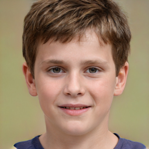 Joyful white child male with short  brown hair and brown eyes