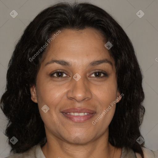 Joyful latino adult female with medium  brown hair and brown eyes