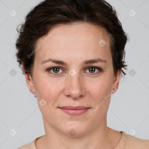 Joyful white adult female with short  brown hair and grey eyes