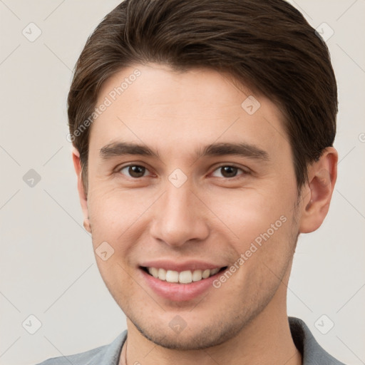 Joyful white young-adult male with short  brown hair and brown eyes