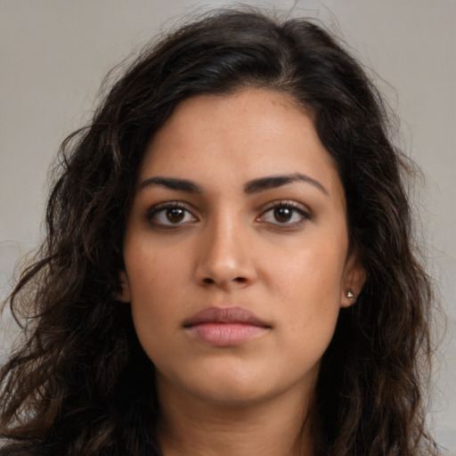 Neutral latino young-adult female with long  brown hair and brown eyes