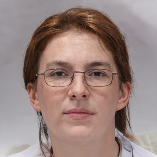 Joyful white adult female with medium  brown hair and grey eyes