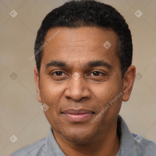 Joyful latino adult male with short  black hair and brown eyes