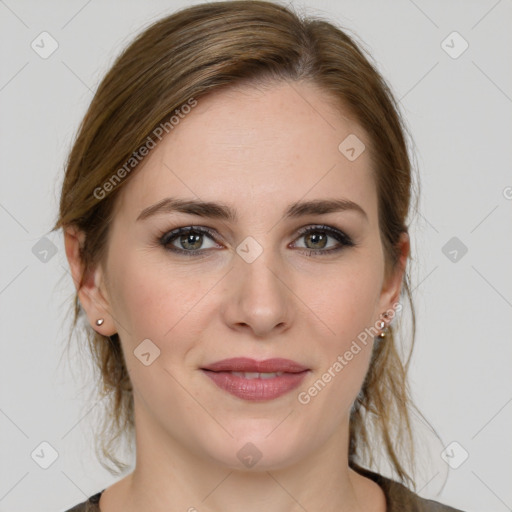 Joyful white young-adult female with medium  brown hair and green eyes