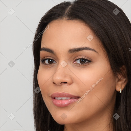 Joyful latino young-adult female with long  brown hair and brown eyes