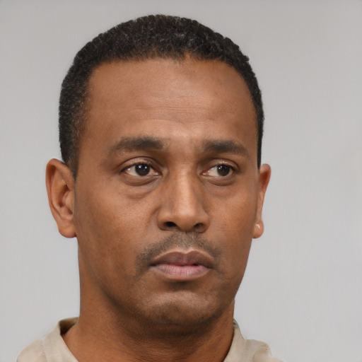 Neutral black young-adult male with short  brown hair and brown eyes