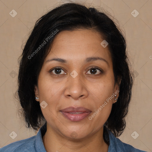 Joyful latino adult female with medium  brown hair and brown eyes