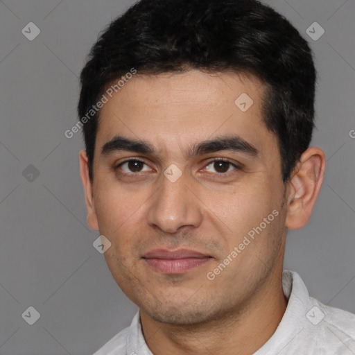 Joyful white young-adult male with short  black hair and brown eyes