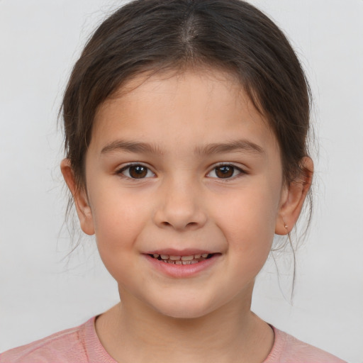 Joyful white child female with medium  brown hair and brown eyes