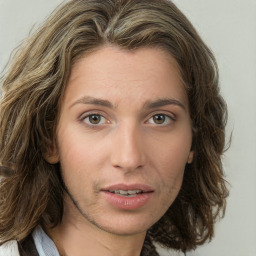 Neutral white young-adult female with medium  brown hair and green eyes