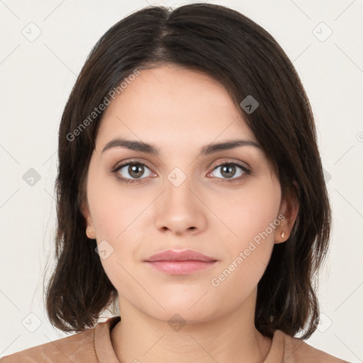 Neutral white young-adult female with medium  brown hair and brown eyes