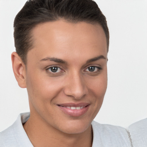 Joyful white young-adult female with short  brown hair and brown eyes