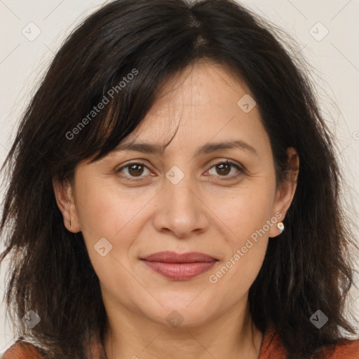 Joyful white adult female with long  brown hair and brown eyes