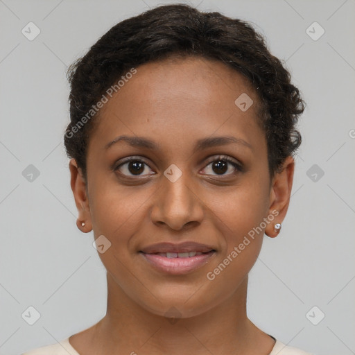 Joyful black young-adult female with short  brown hair and brown eyes