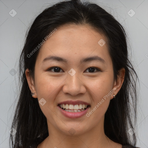 Joyful asian young-adult female with long  brown hair and brown eyes