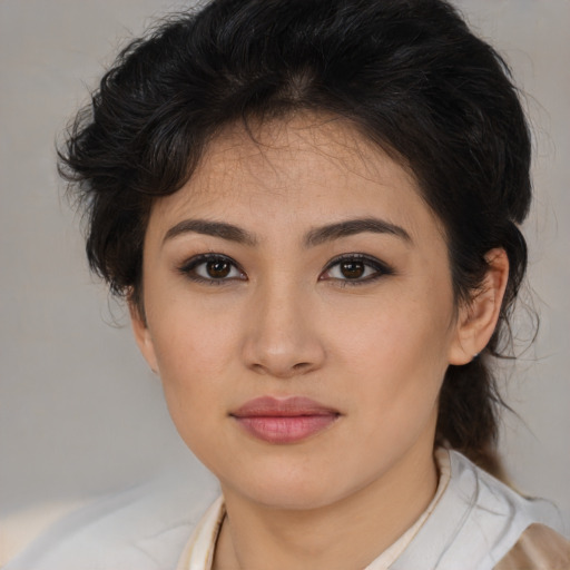 Joyful asian young-adult female with medium  brown hair and brown eyes