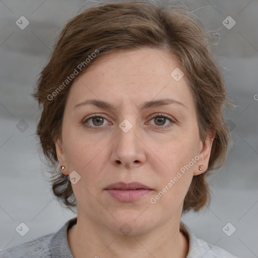 Joyful white adult female with medium  brown hair and grey eyes