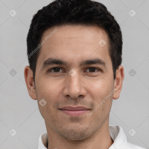 Joyful white young-adult male with short  black hair and brown eyes