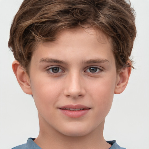 Joyful white child male with short  brown hair and grey eyes