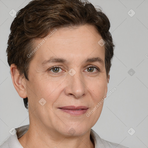 Joyful white adult female with short  brown hair and brown eyes