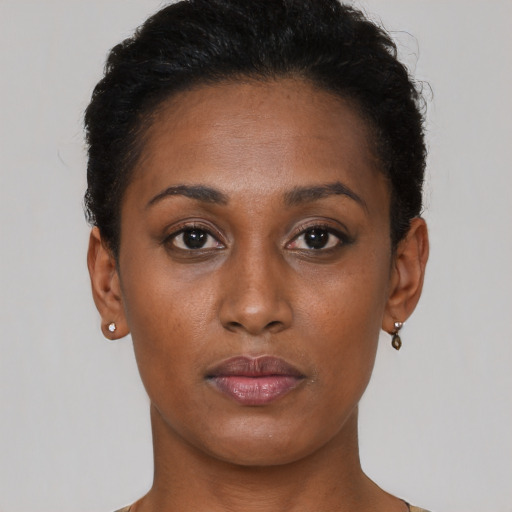 Neutral black young-adult female with short  brown hair and brown eyes